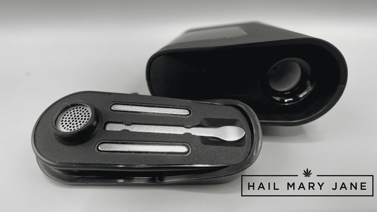 A black Boundless portable dry herb vaporizer with its mouthpiece and chamber open